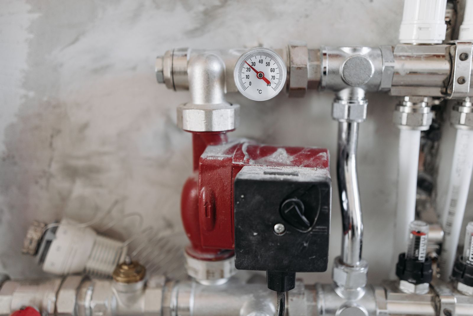 Professional plumbing system with pressure gauge, valves, and pump